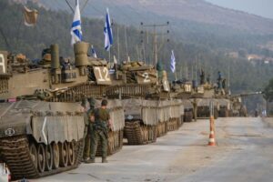 Israeli forces mass near Gaza, Netanyahu issues warning to Hezbollah