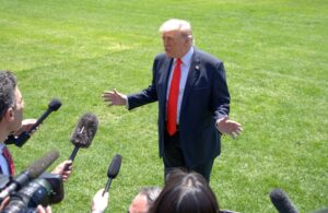 Trump reviews Iran deal, hints troop cuts
